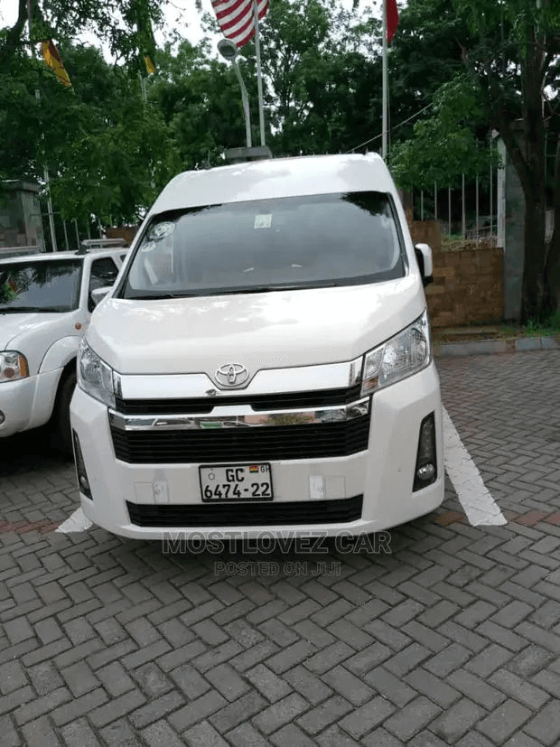White Toyota Hiace commuter van front view, Ghana registration