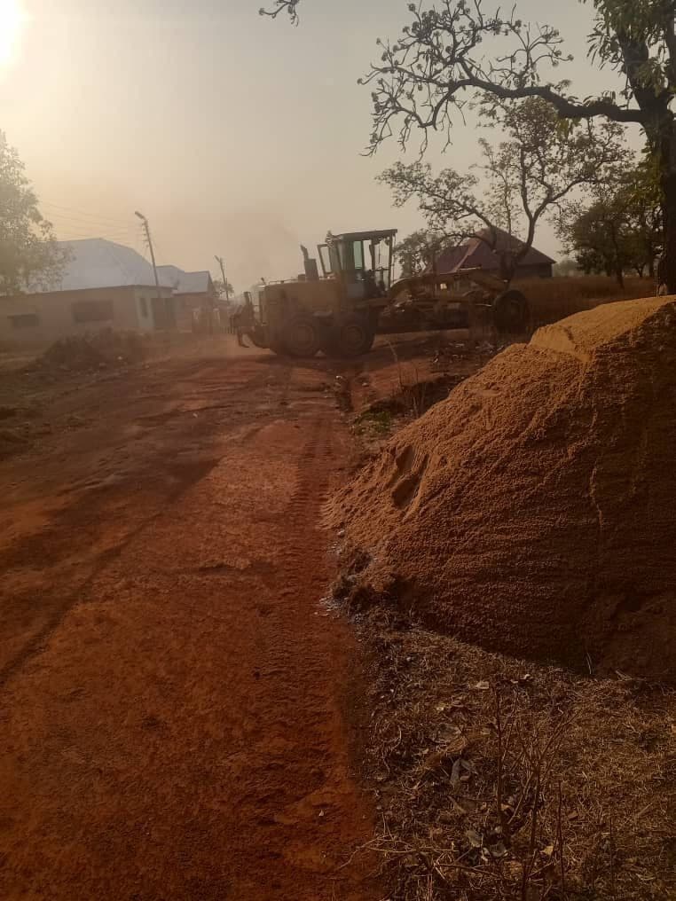 Motor grader levelling a road during construction and rehabilitation works